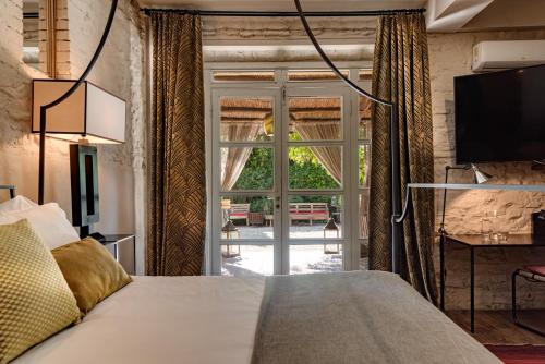 Postel nebo postele na pokoji v ubytování La Striscia Wine Resort