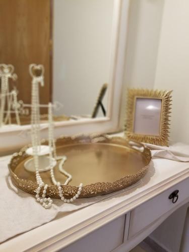 a bathroom counter with a sink and a mirror at Corfu Escape Four in Agios Georgios Pagon