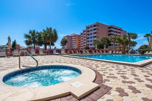 a swimming pool with a hot tub in a resort at The Islander 412 in Destin