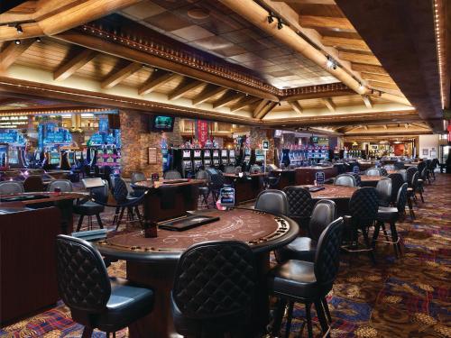 a bar with tables and chairs in a casino at Ameristar Casino Black Hawk in Black Hawk