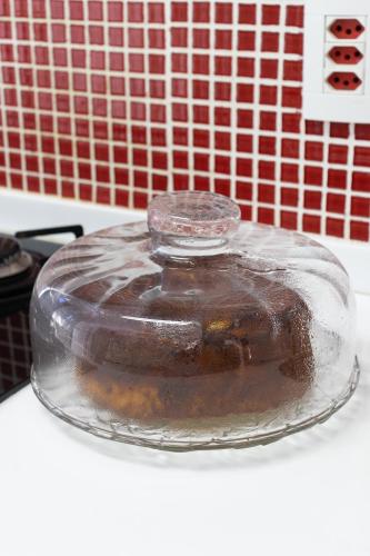 a glass jar filled with chocolate on top of a counter at Casa azul Ilha Grande in Abraão