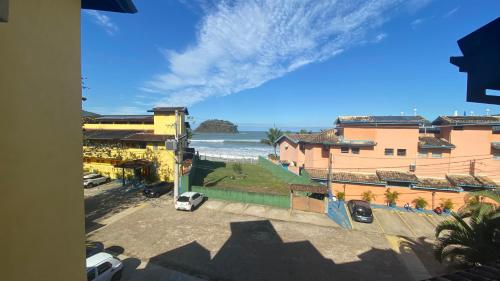 a view of the beach from a building at Kaliman Pousada in Ubatuba