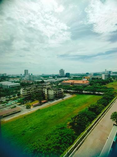 an aerial view of a city with a green field at Peace home in Cyberjaya