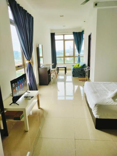 a living room with a bed and a couch at Peace home in Cyberjaya