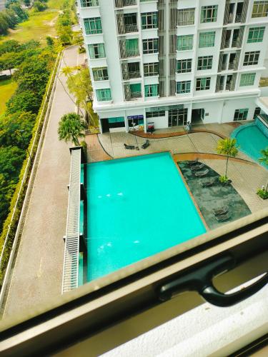 a pair of scissors sitting on top of a swimming pool at Peace home in Cyberjaya