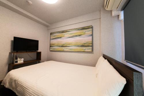 Cama o camas de una habitación en Stay Hakata