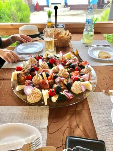 a plate of food on top of a table at La Konac in Murighiol