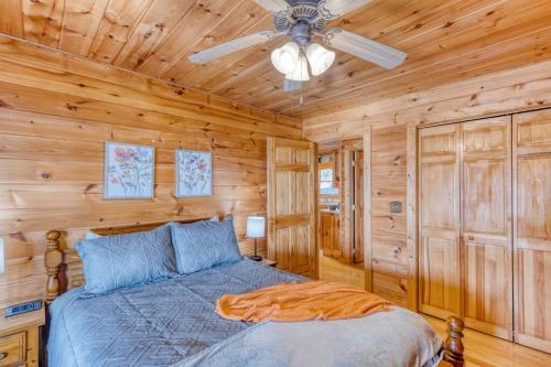 a bedroom with a bed and a ceiling fan at MTN Cabin Sleeps 10 - 5 Mins To Fishing & Camping in Ellijay