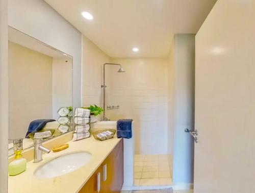 a bathroom with a sink and a shower at The Best Ocean and Mountain views in the city in Jacó