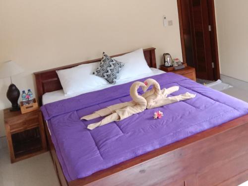 Кровать или кровати в номере Jana's Homestay