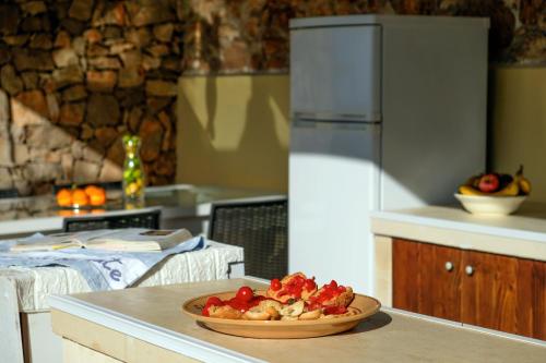 a kitchen with a plate of food on a counter at Antico Trullo Salentino in Salve