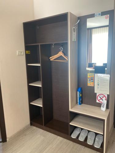 a wardrobe in a room with its door open at Pensiunea Damiro in Orşova