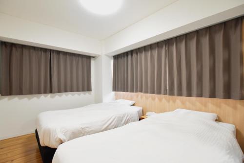 Säng eller sängar i ett rum på Randor Residence Tokyo Classic