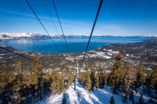 a ski lift with a view of a lake at Resort at Squaw Creek II in Olympic Valley
