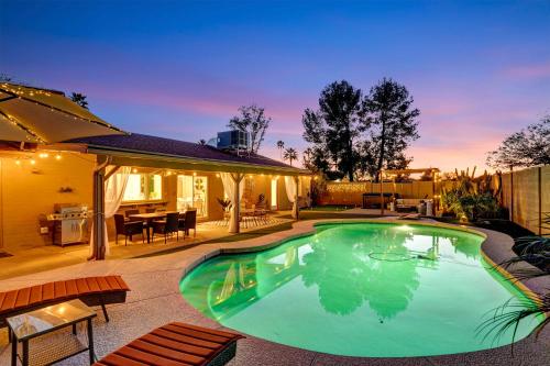 a swimming pool in the backyard of a house at Scottsdale Designer Oasis - Private Pool & Insta Getaway in Scottsdale