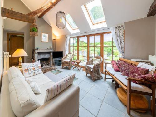 a living room with a couch and a fireplace at Charming Cottage in Anseremme with Fenced Garden in Dinant