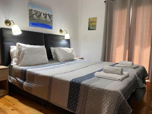 Postel nebo postele na pokoji v ubytování Alexander Apartments