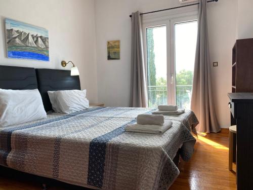 Postel nebo postele na pokoji v ubytování Alexander Apartments