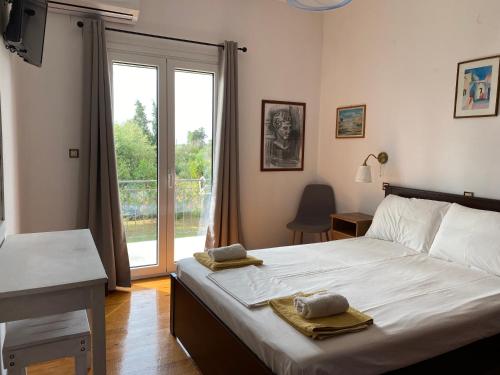 Postel nebo postele na pokoji v ubytování Alexander Apartments