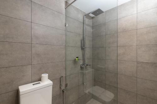 a shower stall with a toilet in a bathroom at MaRadha Colombo in Colombo