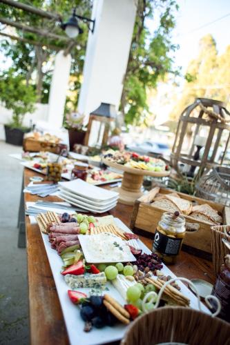 a long table filled with different types of food at Mont d'Or Swartberg Hotel in Prince Albert