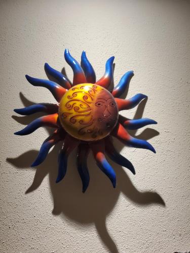a blue and orange toy sun on a wall at Hacienda Gallardos 104-4 in San Carlos