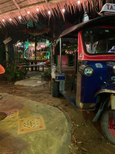 a vehicle is parked in a building with a rug at Freedom home in Ko Chang