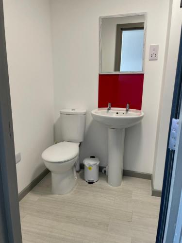 a bathroom with a toilet and a sink at Rooms in Inverness in Inverness