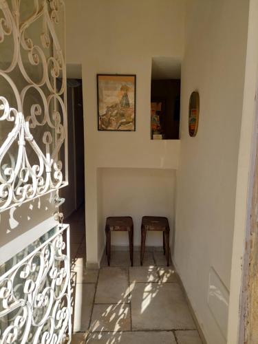 a stairway with two chairs in a room at Legatia in Jerusalem
