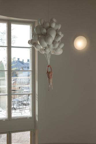 a bunch of balloons hanging from a ceiling at RUNO Hotel Porvoo in Porvoo