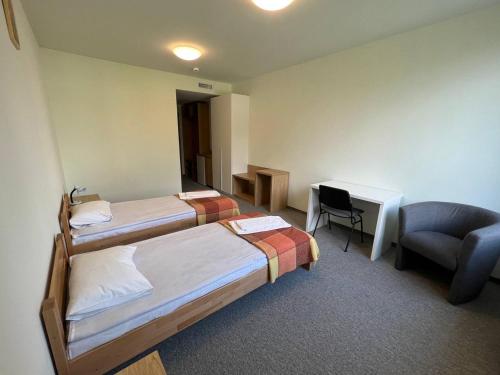 Cama o camas de una habitación en UCU INN - Кімнати для гостей