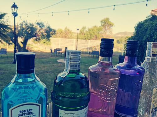 a group of three wine bottles sitting on a table at Hostal Rural Fidel Garcia Guzman in Chera
