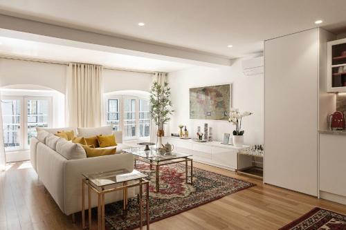 a living room filled with furniture and a fireplace at Lisbon Rentals Chiado in Lisbon