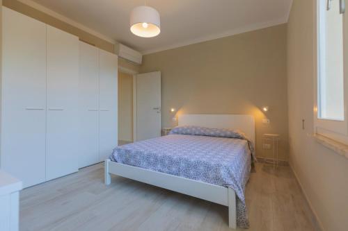 Postel nebo postele na pokoji v ubytování HelloElba Appartamento La Triglia