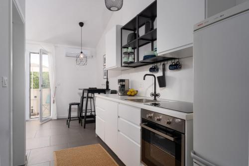 Kuchyň nebo kuchyňský kout v ubytování Villa Fio by SeeAdria Agency