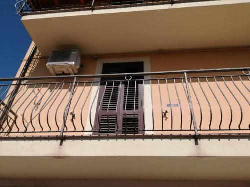 a balcony with a heater and a window on a building at B&B da Giovanna Dimora del Turista in Santa Maria del Cedro