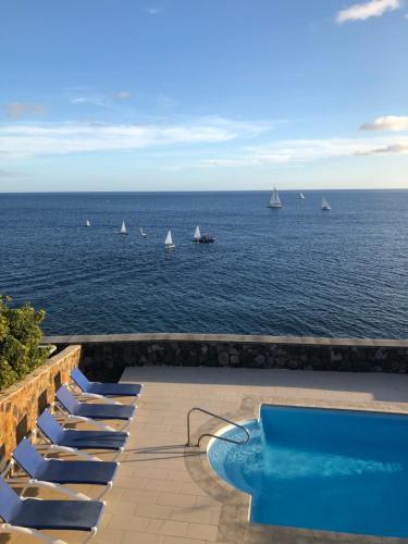 a view of the ocean with boats in the water at Seafront Puerto Calero Villa in Puerto Calero
