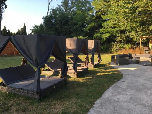 a group of tents sitting in the grass at Désir'ôôm in Cabannes