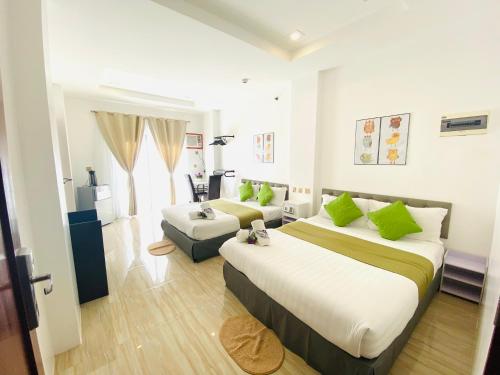 Postel nebo postele na pokoji v ubytování Mirage Suites de Boracay