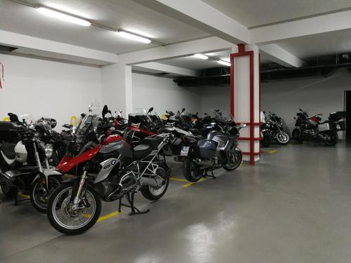 a bunch of motorcycles parked in a garage at Medjugorje Hotel & Spa in Međugorje
