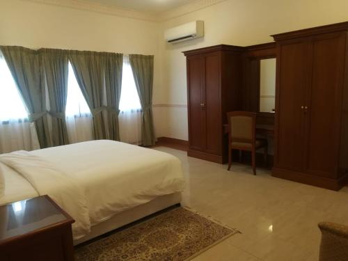 Postel nebo postele na pokoji v ubytování Salalah Premium Villas