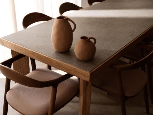two vases sitting on top of a wooden table at Cielo villas - An Authentic Mediterranean Living in Zakynthos Town