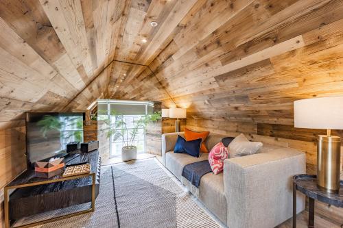 a living room with a wooden wall at No1 Apartments & Bedrooms St Andrews - St Mary's in St. Andrews