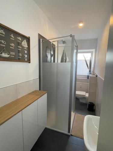 a bathroom with a shower and a sink at Fewo ToNi in Wismar