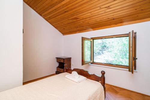 Postel nebo postele na pokoji v ubytování Villa Niko