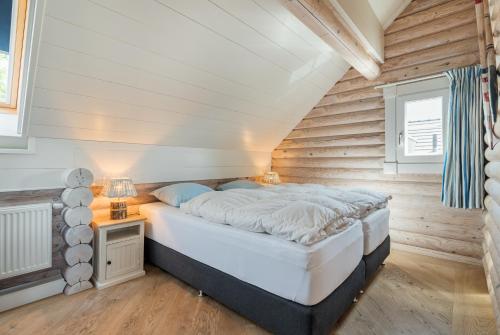 Postel nebo postele na pokoji v ubytování Strandhuis De Pierewaaier