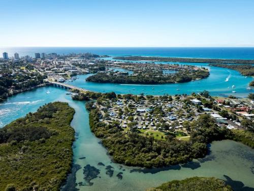an aerial view of a river with a city at Tweed River Retreat in Tweed Heads