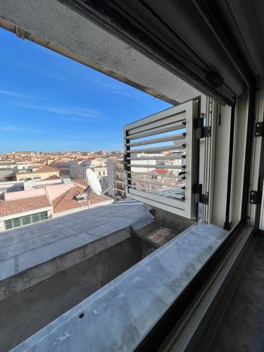 a window with a view of a city at B&B Le Terrazze in Crotone