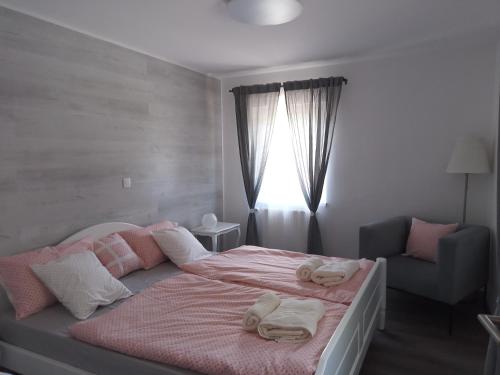 a bedroom with a bed with towels on it at APARTMENT WITH A VIEW in Bohinjska Bistrica