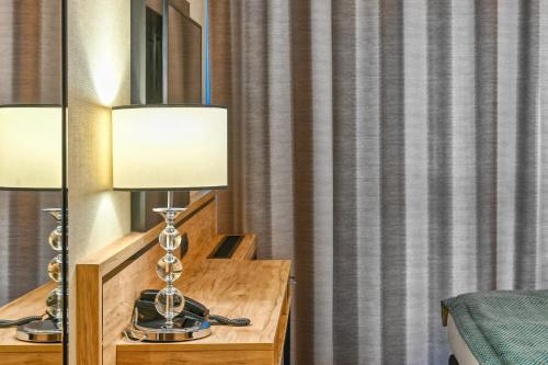 a lamp on a desk in a hotel room at Sopotorium Hotel & Medical Spa in Sopot